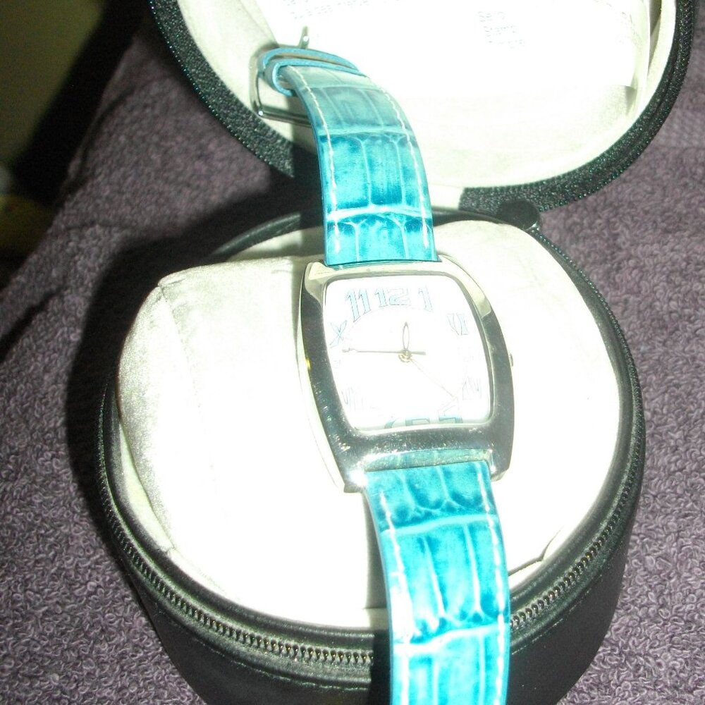 Women's Thermidor wristwatch, teal snakeskin pattern.